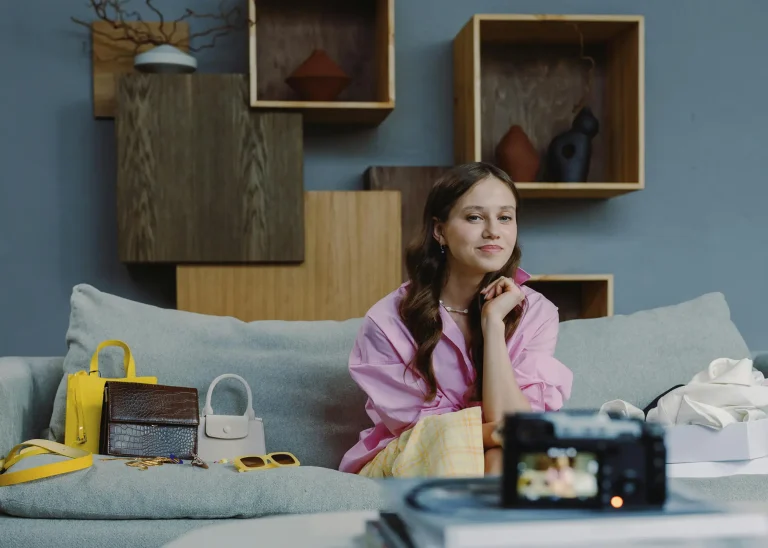 Brunette woman recording video on sofa