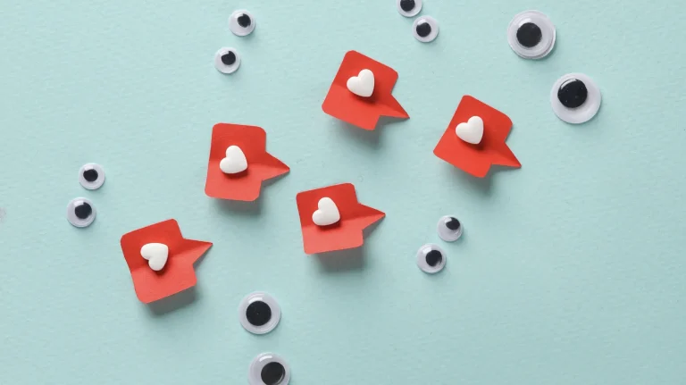 blue background with googly eyes and red heart comments scattered