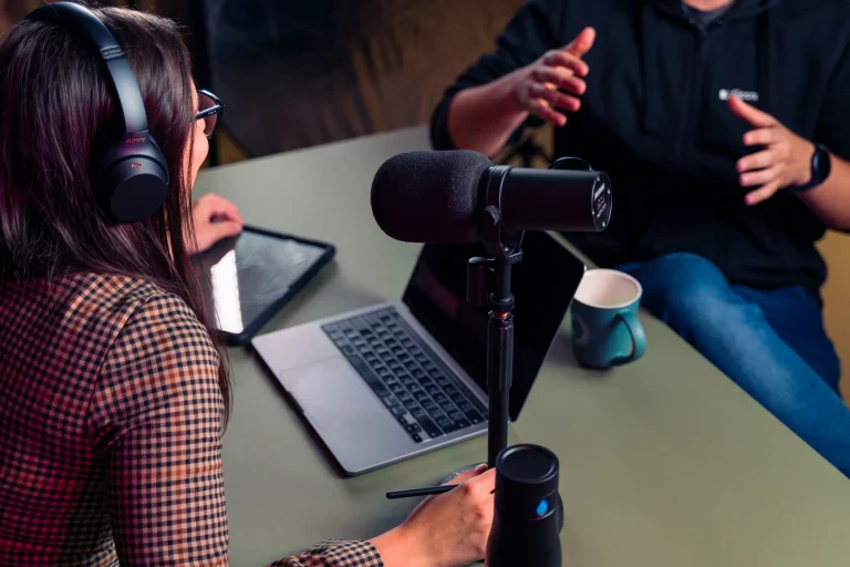a woman and man doing a podcast